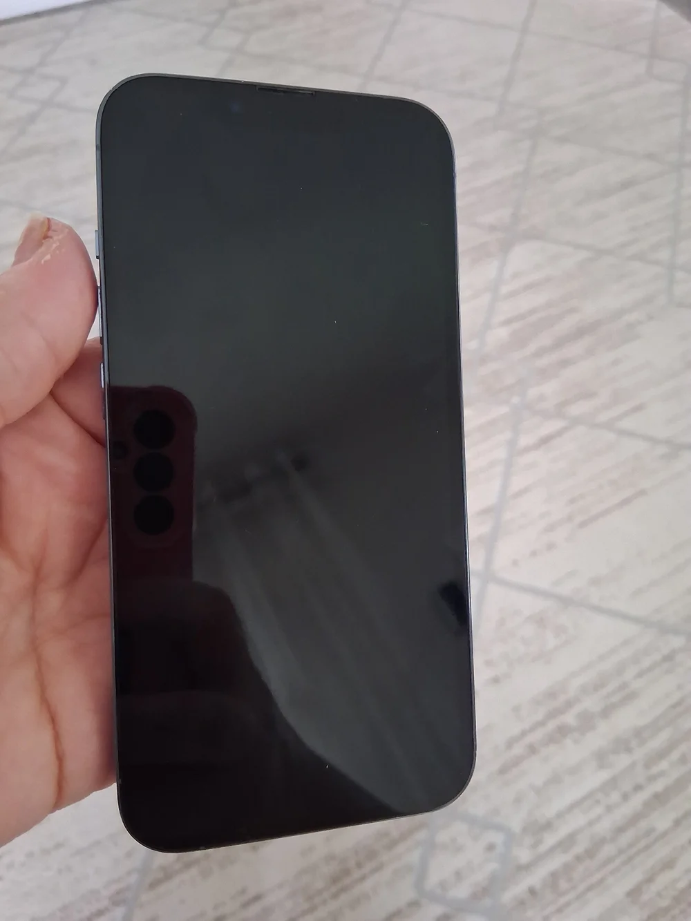 Apple Black Smartphone with Blue-Green Display